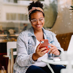 Woman using a smartphone in a casual setting